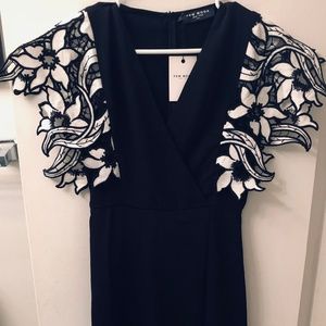 Black dress with flower sleeve accents